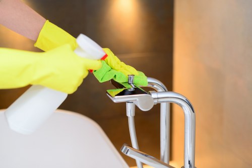 Surrey Quays carpet cleaning team treating stains on a residential carpet