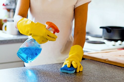 Carpet cleaning technician preparing equipment for a UK home service
